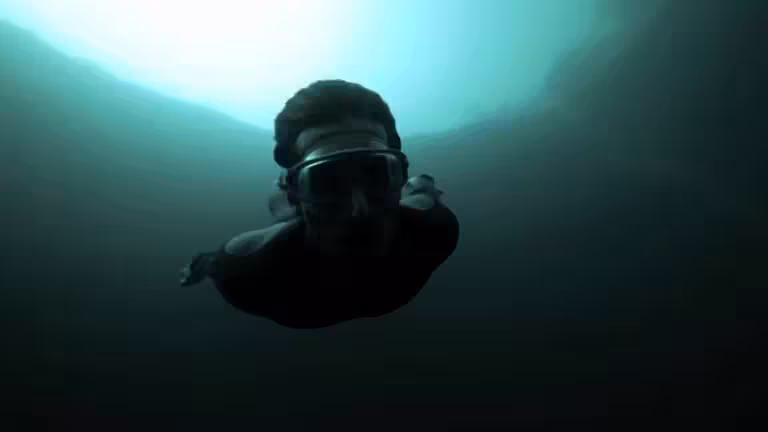 Guillaume Nery base jumping at Dean's Blue Hole photo